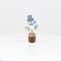 Snowman Otto Chopping Wood