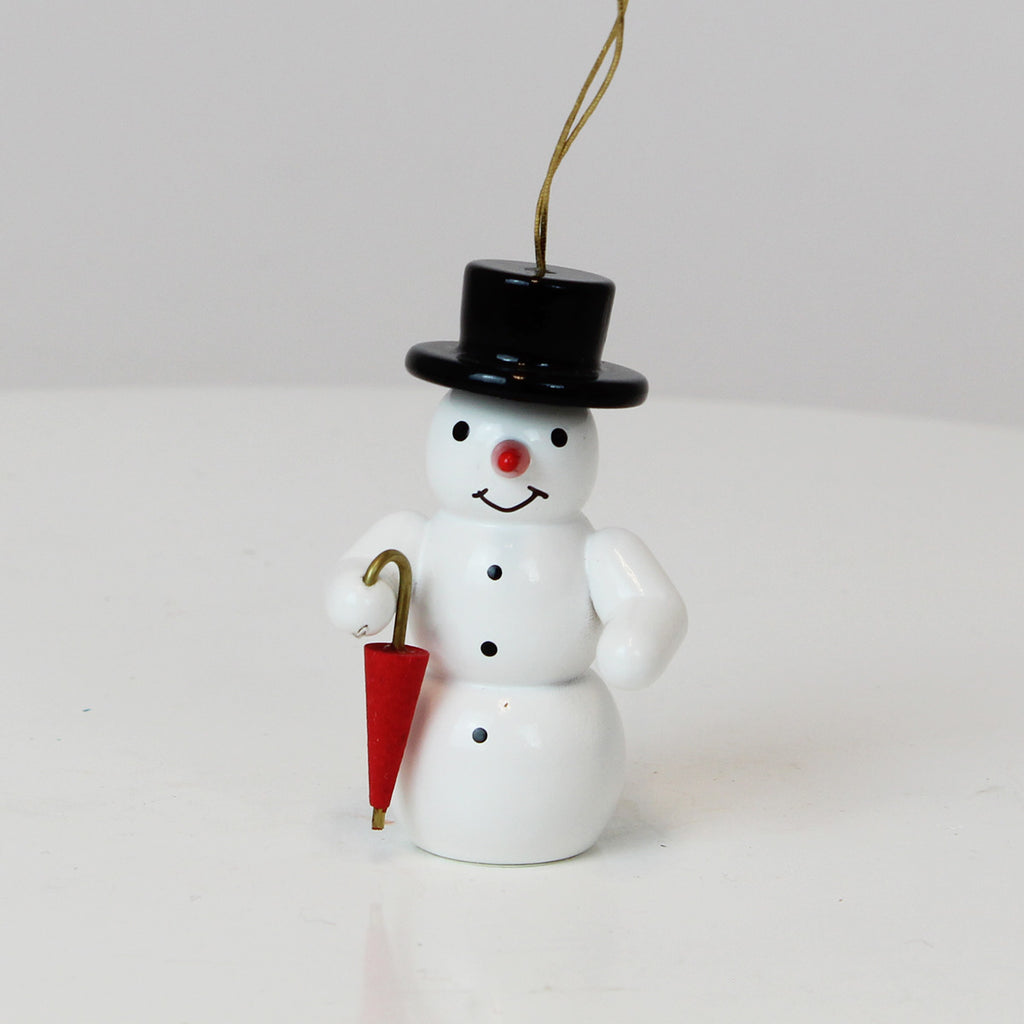 Schmuckschnee mit Regenschirm