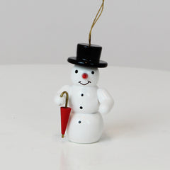 Schmuckschnee mit Regenschirm