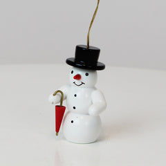 Schmuckschnee mit Regenschirm