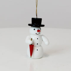 Schmuckschnee mit Regenschirm
