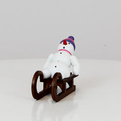 Snowman on Sled