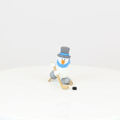 Snowman Otto Playing Ice Hockey