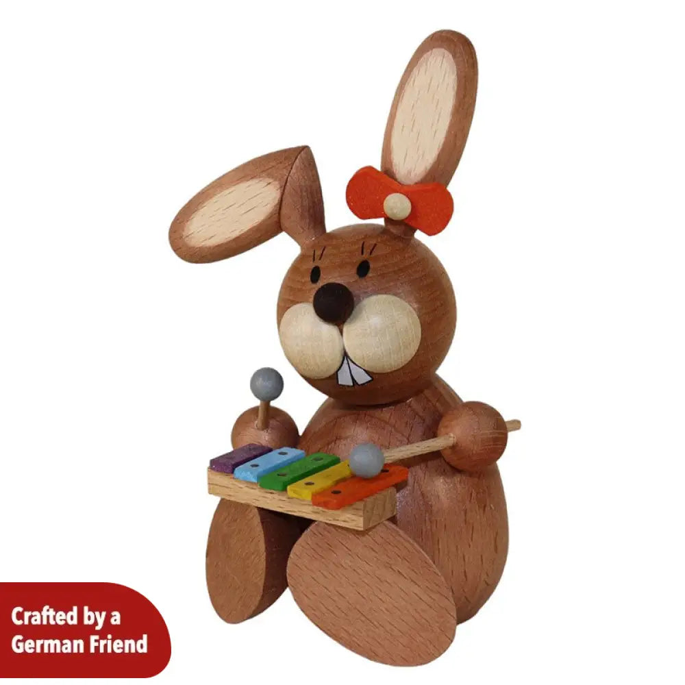 Rabbit woman plays the xylophone