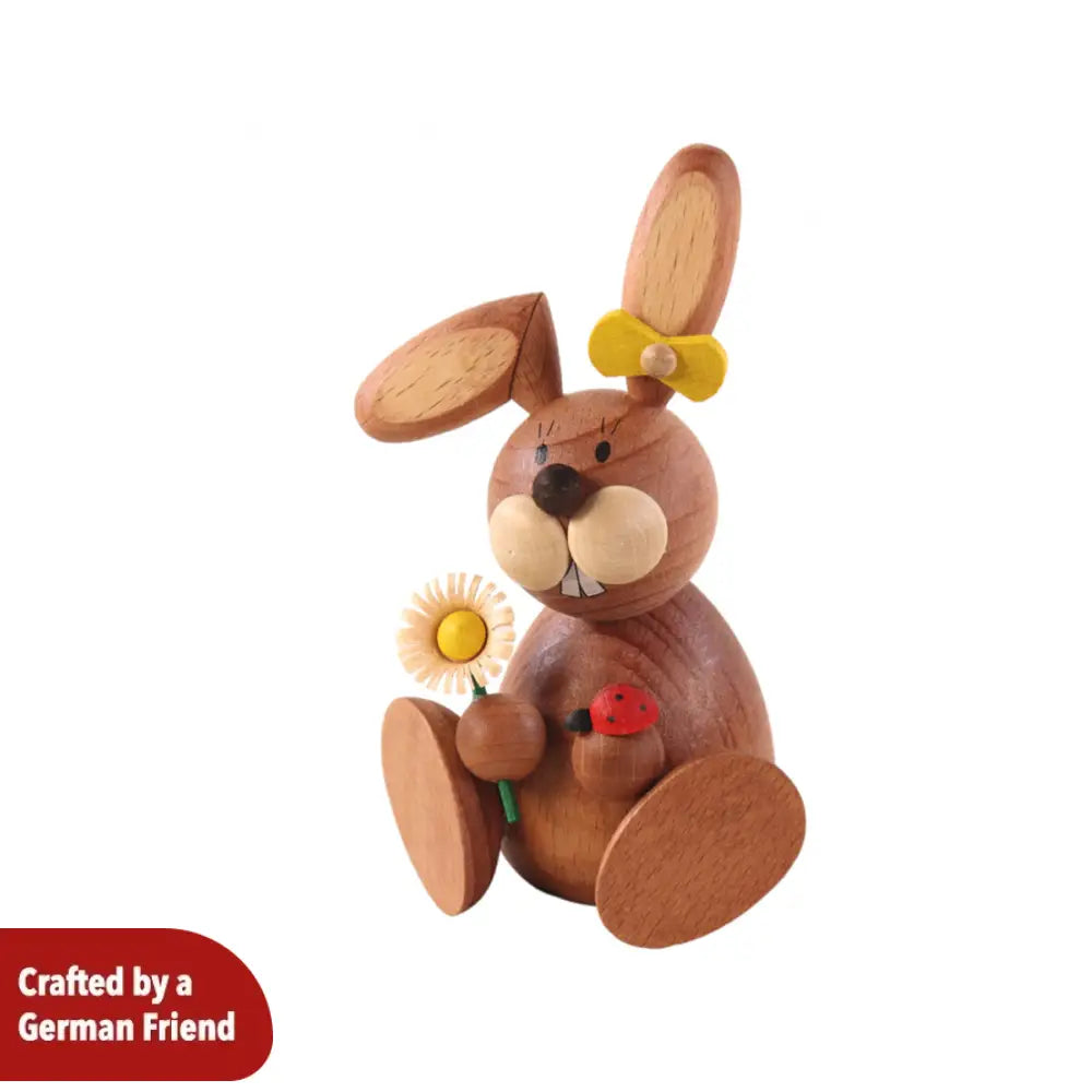 Rabbit woman with a daisy and ladybug