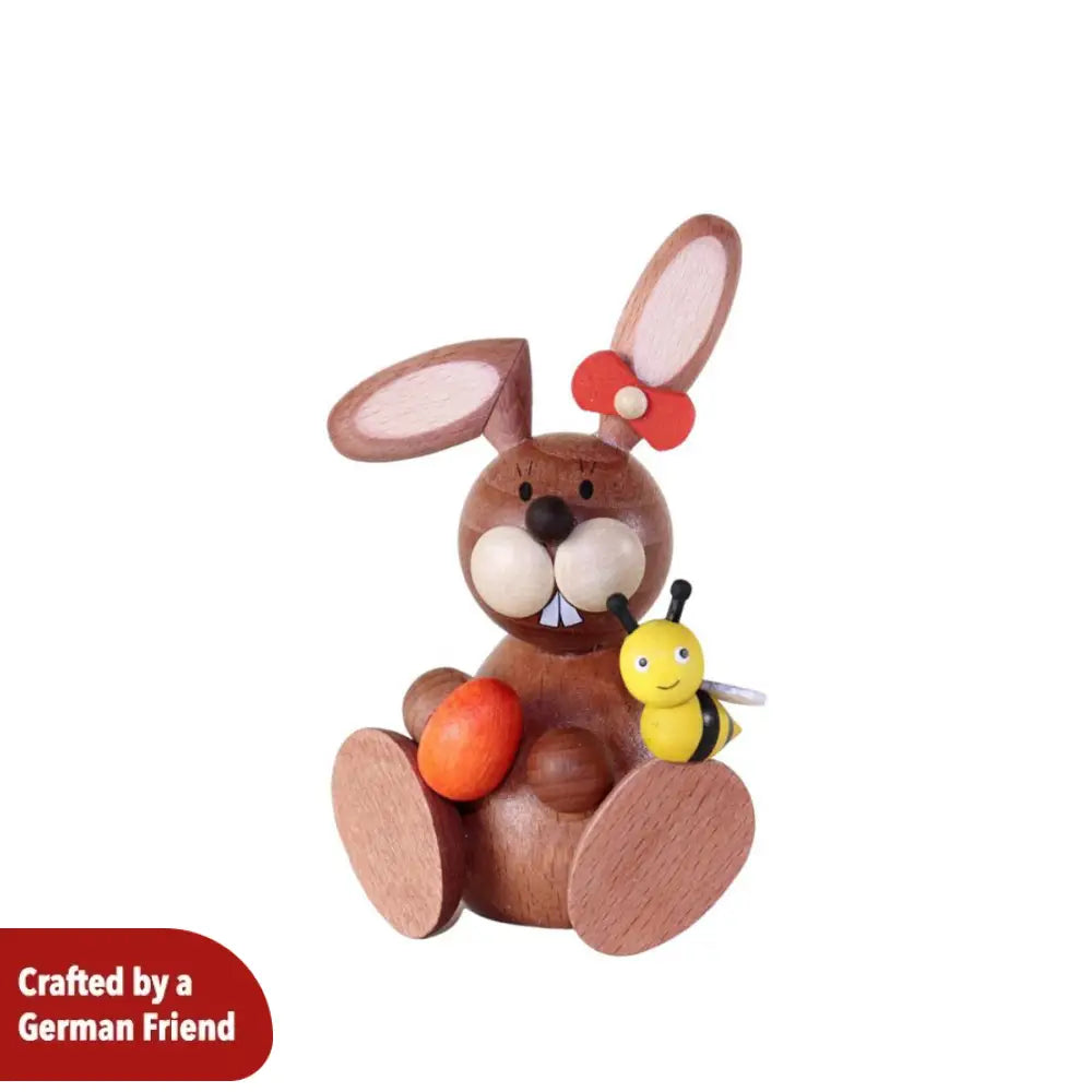 Rabbit woman with an egg and a bee