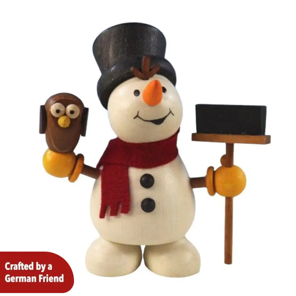Snowman with owl and broom