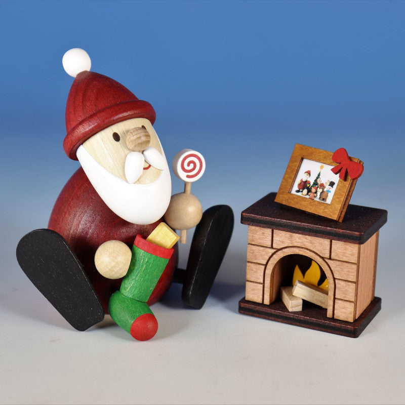 Santa stuffing a stocking